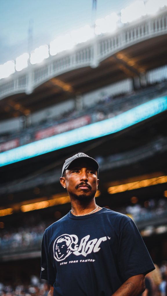 Pharrell Talks BBC x Yankee Collection At Yankees-Mets Subway Series –